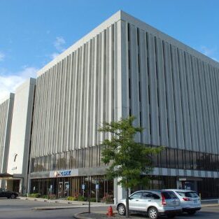 A building with many windows on the outside of it